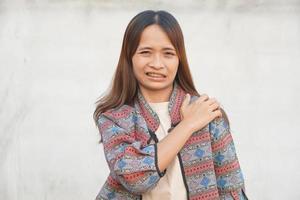 Asian woman having shoulder pain photo