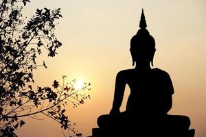 big buddha silhouette sunset background.Makha Bucha Day.Vesak Day.Asanha Bucha.Buddhist Lent. photo