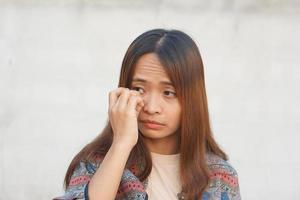 Asian woman has itchy eyes photo