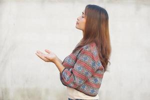 Asian woman praying to god photo