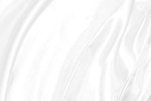 de cerca elegante estropeado de blanco seda tela paño antecedentes y textura foto