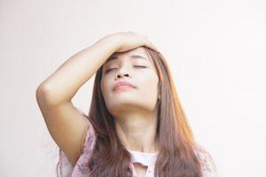 Asian woman having a headache from work photo