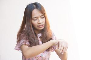 Woman holding her wrist pain from using computer, office syndrome photo