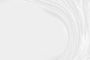 white silk textured cloth background,Closeup of rippled satin fabric with soft waves. photo
