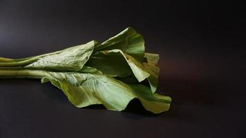 Chinese green mustard on black background photo