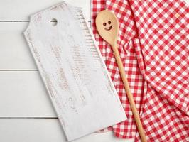 rectangular empty wooden cutting boards and red towel photo