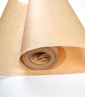 rolled brown parchment paper roll for baking photo