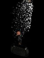 Chef in black uniform holds a pan with white salt and throws up photo