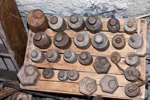 old balance iron weights different sizes photo