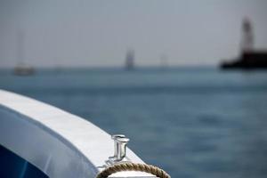 boat bollard detail on blue water background photo