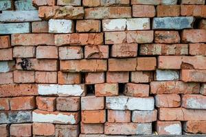 Beautiful texture old brick from big wall block, natural structure close up photo