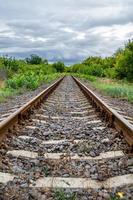 Photography to theme railway track after passing train on railroad photo