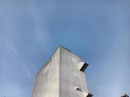 Tower of factory building with a clear blue sky background photo