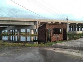 Damaged building beside the flyover photo