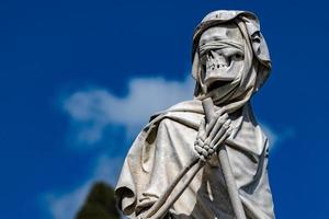 death marble statue over a tomb in florence cemetery photo