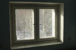Window in building. Interior of building in detail. Window frame from inside. photo