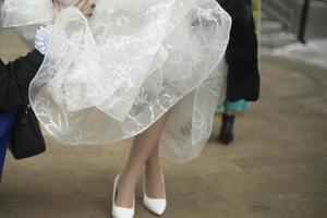 Bride's dress. Clothes for holiday. Wedding details. White dress and shoes. photo