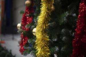 Toys and garlands for Christmas. Decorations on Christmas tree. Garlands on tree. photo