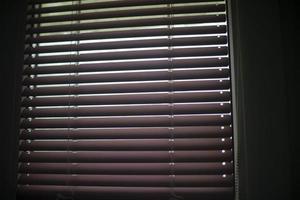 Blinds on window. Window in apartment. Closed blinds. photo