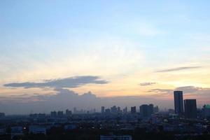 dark blue cloud with white light sky background and city light midnight evening time photo