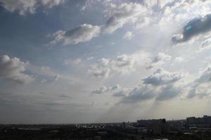 sunset dark blue cloud with white golden light sky background and city light midnight evening time photo