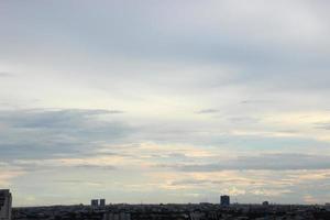 dark blue cloud with white light sky background and city light midnight evening time photo