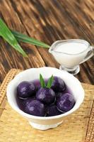 Candil Ubi Ungu or Purple Sweet Potato Balls with Palm Sugar and Coconut Milk Sauce photo