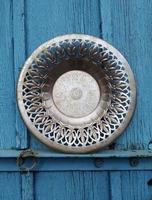 View on metal bowl with patterns on a wooden background photo