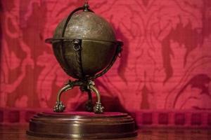 Ancient copper earth globe photo