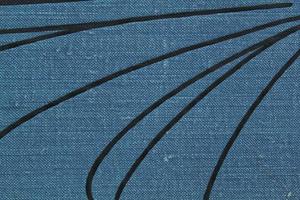 Abstract design background of gray coarse-grained intersection texture of rough fabric with an interlacing black painted lines. Linen sack textile canvas burlap cloth. Close-up, mock up, top view photo