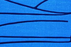 Abstract design background of blue coarse-grained intersection texture of rough fabric with an interlacing black painted lines. Linen sack textile canvas burlap cloth. Close-up, mock up, top view photo