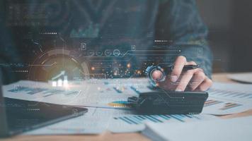Businessman reading chart report Virtual Business Statistics ,analyze and improve corporate strategy, manage financial and marketing documents, annual budget accounts, futuristic technology solution photo