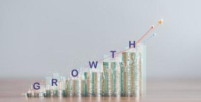 stack of coins and profit growth graph ,concept business growth, progress in development financial performance and investment, with business strategies for future goals and opportunities photo