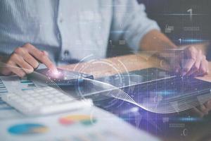 Businessman reading chart report Virtual Business Statistics ,analyze and improve corporate strategy, manage financial and marketing documents, annual budget accounts, futuristic technology solution photo