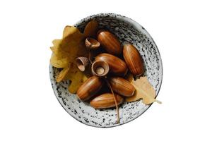 4081 Brown nuts in a bowl isolated on a transparent background photo