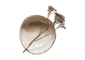 1901 Beige bowl with a dried flower isolated on a transparent background photo