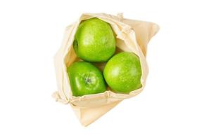 3499 Fabric bag with green apples fruit isolated on a transparent background photo