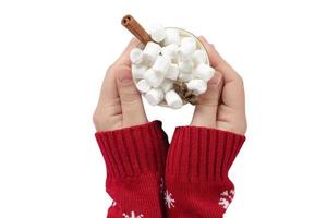 6476 White woman hand holding a mug with marshmallows isolated on a transparent background photo