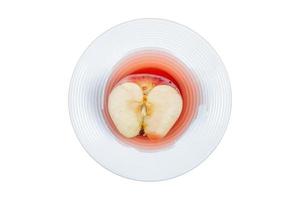 3315 White plate with half red apple isolated on a transparent background photo