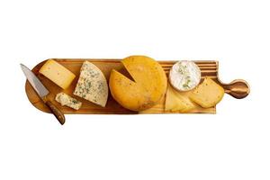 3559 Wooden board with mix of cheese isolated on a transparent background photo