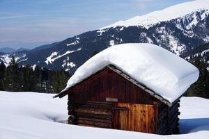 dolomites snow panorama big landscape hut covered by snow photo