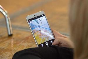 Hands while taking video pictures on cellular smartphone photo