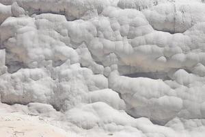 Texture of Pamukkale famous blue travertine pools and terraces photo