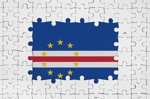 Cabo verde flag in frame of white puzzle pieces with missing central part photo