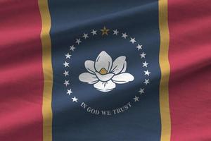 Mississippi new US state flag with big folds waving close up under the studio light indoors. The official symbols and colors in banner photo