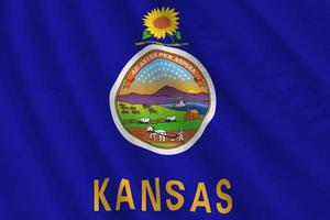 Kansas US state flag with big folds waving close up under the studio light indoors. The official symbols and colors in banner photo