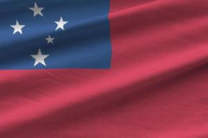 Samoa flag with big folds waving close up under the studio light indoors. The official symbols and colors in banner photo