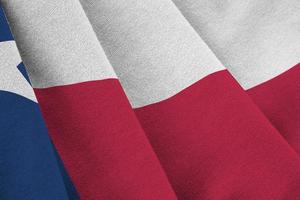 Texas US state flag with big folds waving close up under the studio light indoors. The official symbols and colors in banner photo