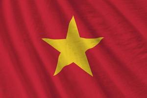 Vietnam flag with big folds waving close up under the studio light indoors. The official symbols and colors in banner photo