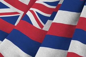 Hawaii US state flag with big folds waving close up under the studio light indoors. The official symbols and colors in banner photo